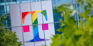 Deutsche Telekom logo in rainbow colors on the facade of an office building 