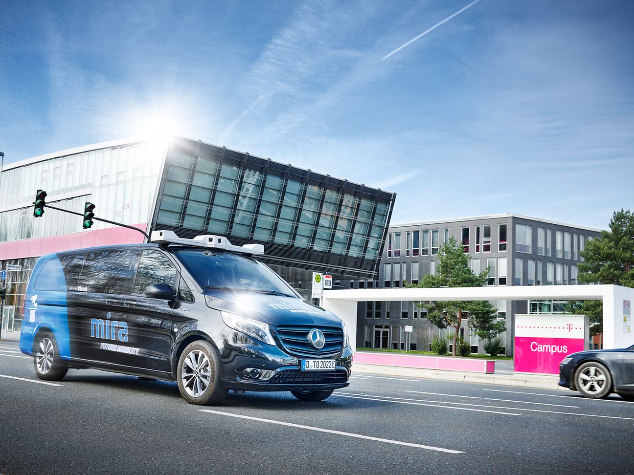 A car remote-controlled by mobile communications takes part in inner-city road traffic. 