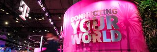 View of Deutsche Telekoms stall at MWC 2024 with slogan "Connecting your world".