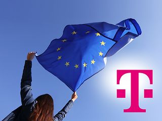 The picture shows a young woman waving a European flag above her head in front of a blue sky.