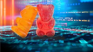 Image montage: two gummy bears in front of an environment of software codes. 