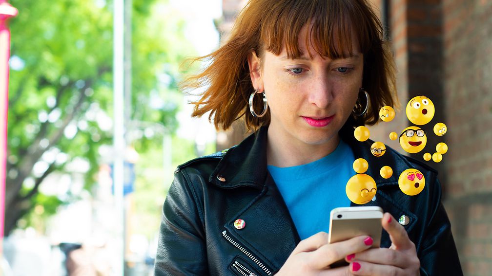 Young woman checking messages on her smartphone.