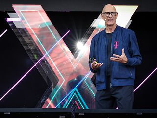 Tim Höttges in front of an "X" on the Digital X stage