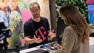 A woman and a man consulting at the sales counter 