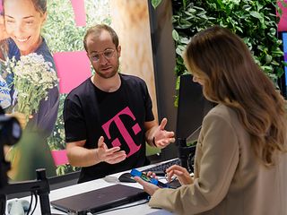 A woman and a man consulting at the sales counter 