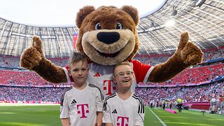 Jonte and Milo with club mascot Berni. 