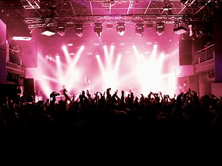 Dancing crowd and DJ in the Electronic Beats concert hall.