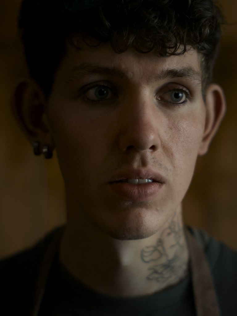 The picture shows a young man with a shocked expression on his face