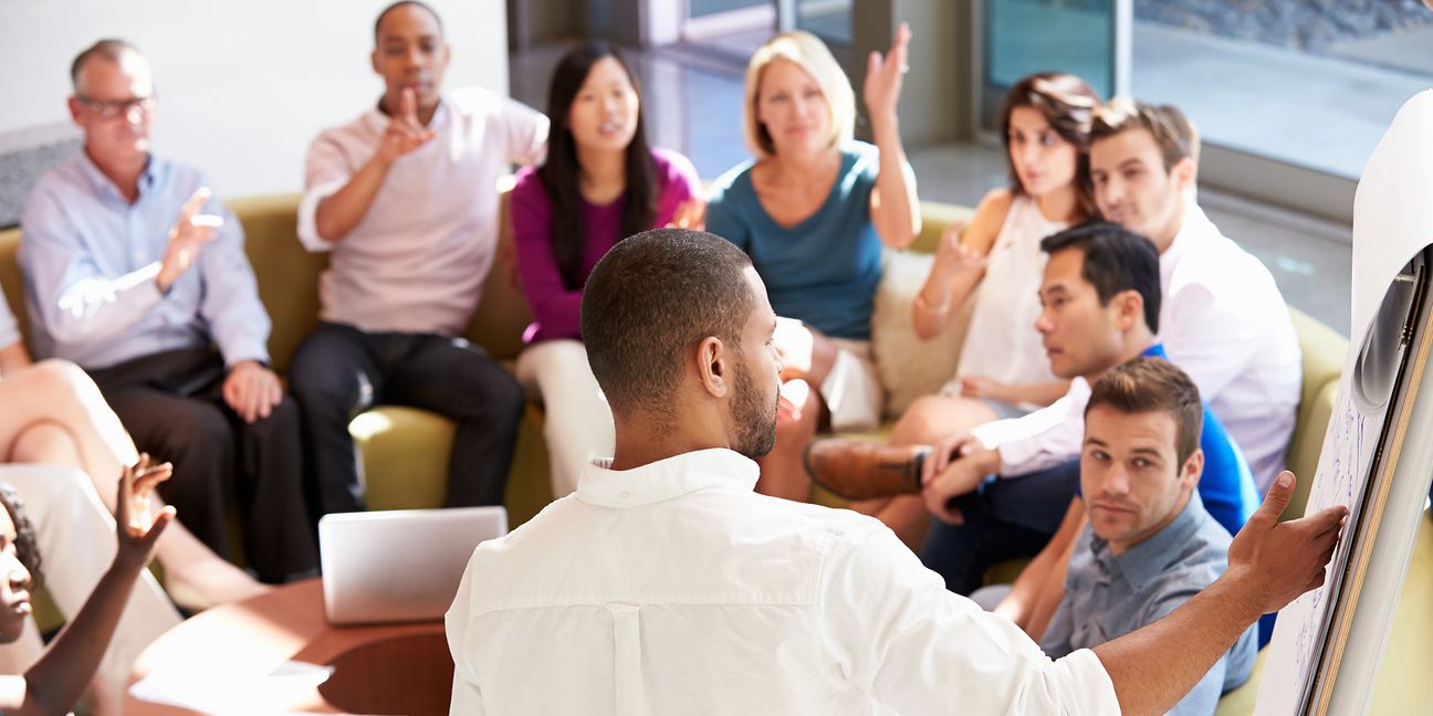 Man presenting in a team meeting.