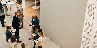 People standing in a room and talking