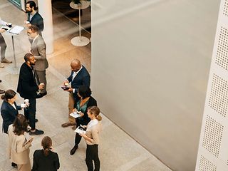 People standing in a room and talking