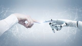 Human hand and robot hand touch.