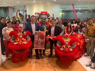 Performing Chinese New Year celebrations in the Singapore office