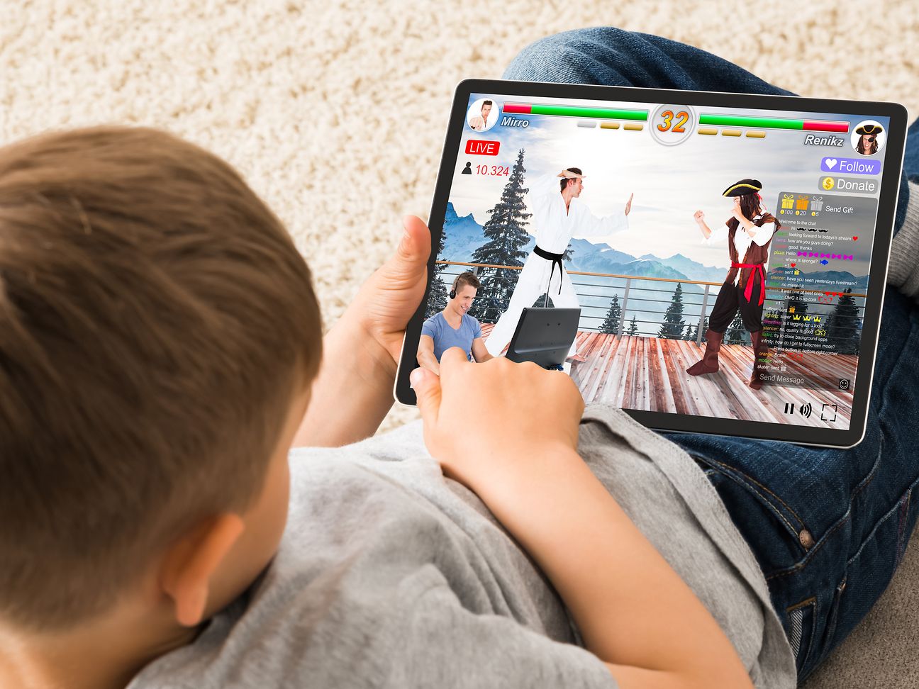 Child is playing on its tablet.