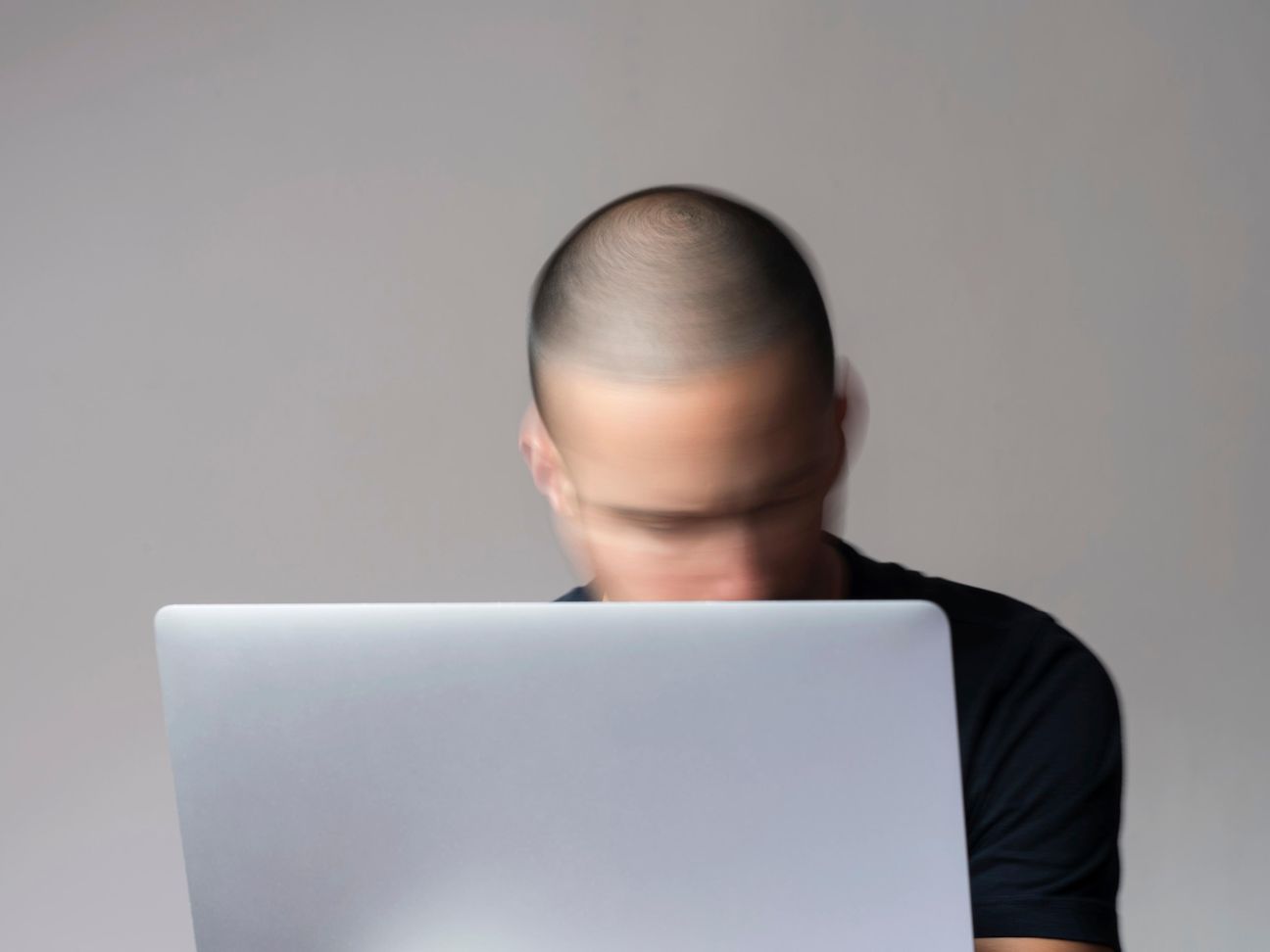 Man behind a notebook